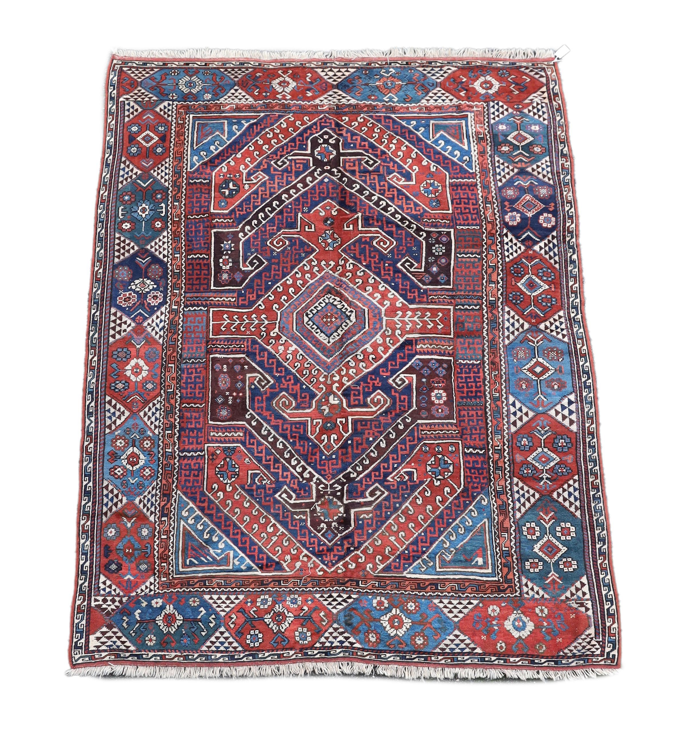 A Bergam Turkish blue ground rug 254 x 198cm